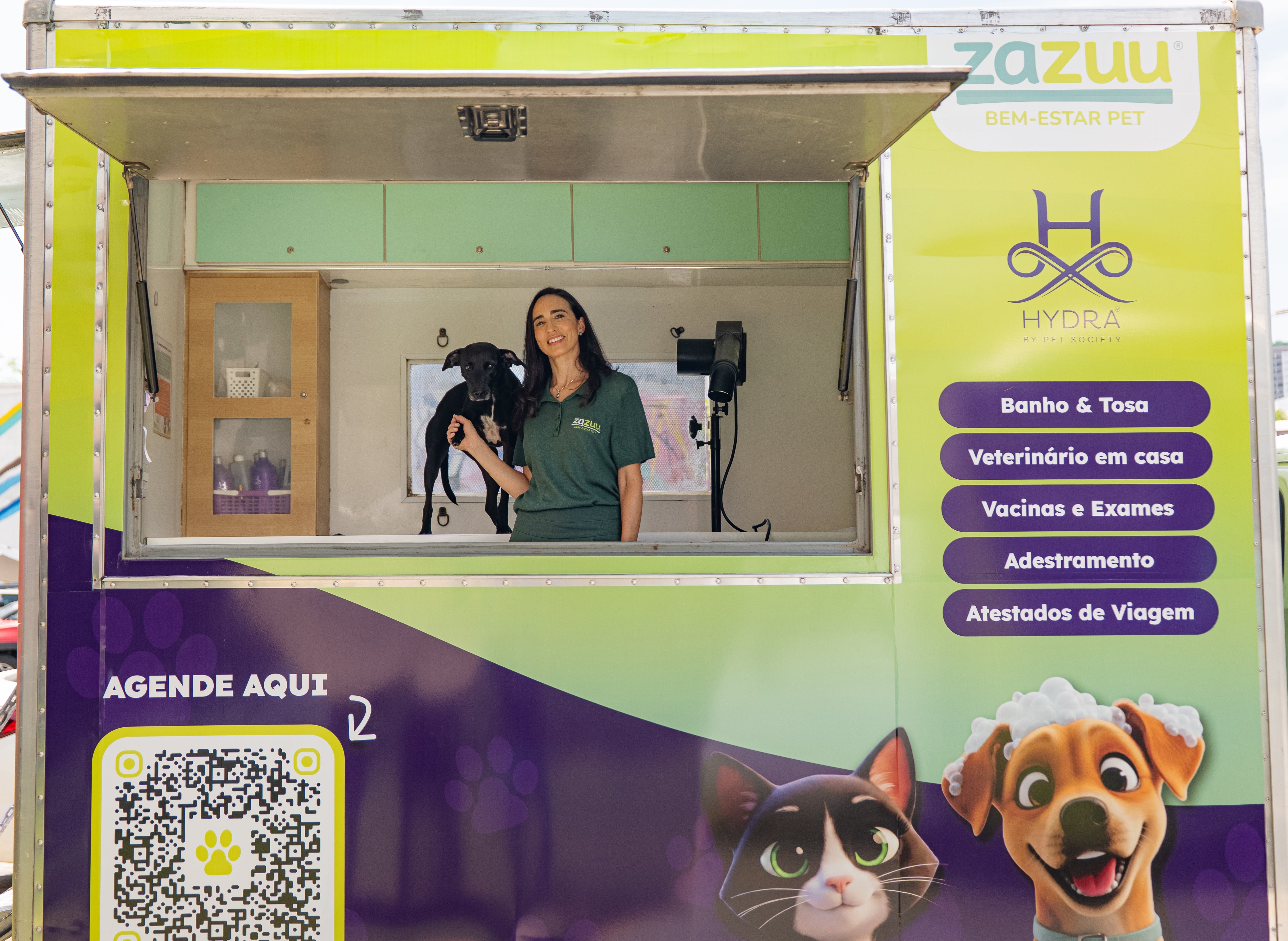 zazuu mobile pet care truck with Aline Lex holding a dog